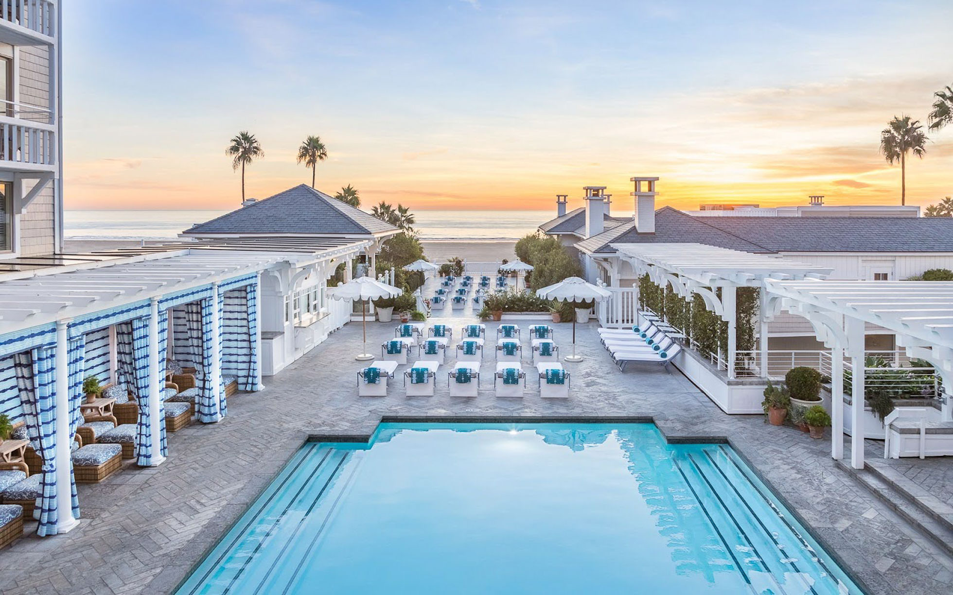 Luxurious Southern California beach resort pool area, an idyllic setting for bridal parties seeking on-site hair and makeup services.